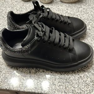 All black Alexander McQueen’s with studs